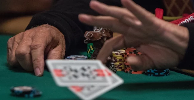 Folding a poker hand.