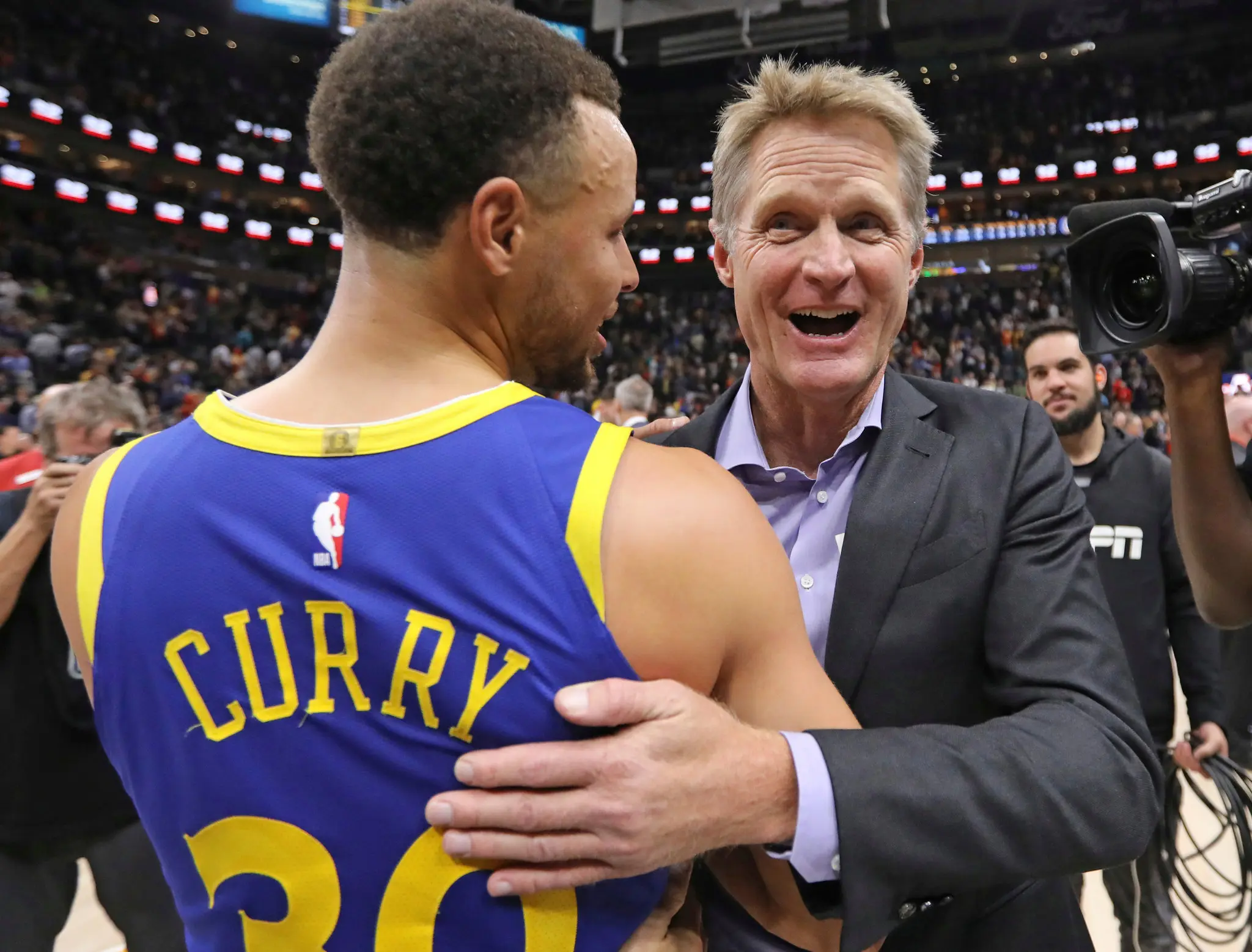 Steve Kerr and Steph Curry having fun while getting it done